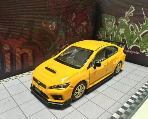 Diecast metal model car in yellow, front three-quarter view, detailed wheels