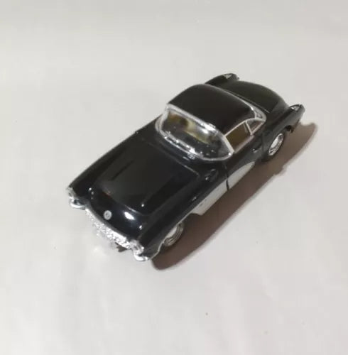 Black 1957 diecast model car, 1:36 scale, glossy hood and chrome details