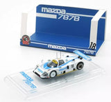 1:64 scale diecast race car, white and blue with #18 markings.