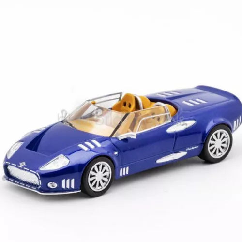Blue 1:64 scale diecast sports car model with yellow interior, open-top design