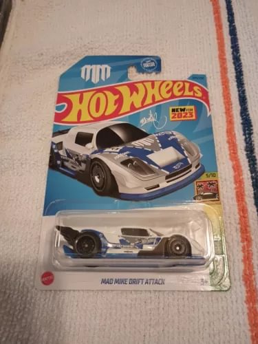 Hot Wheels diecast race car in blister pack, blue and gray drift car with black wheels