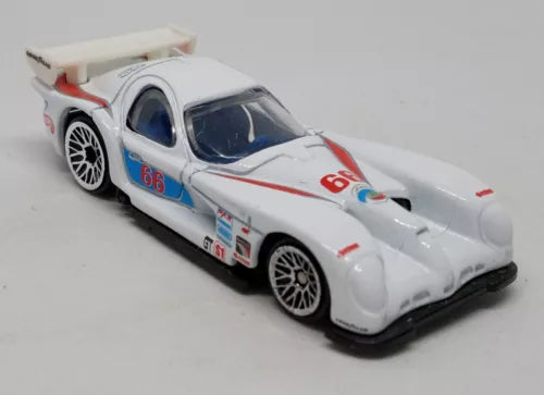 White racing diecast car with blue and red number decals, black tires, front-side view