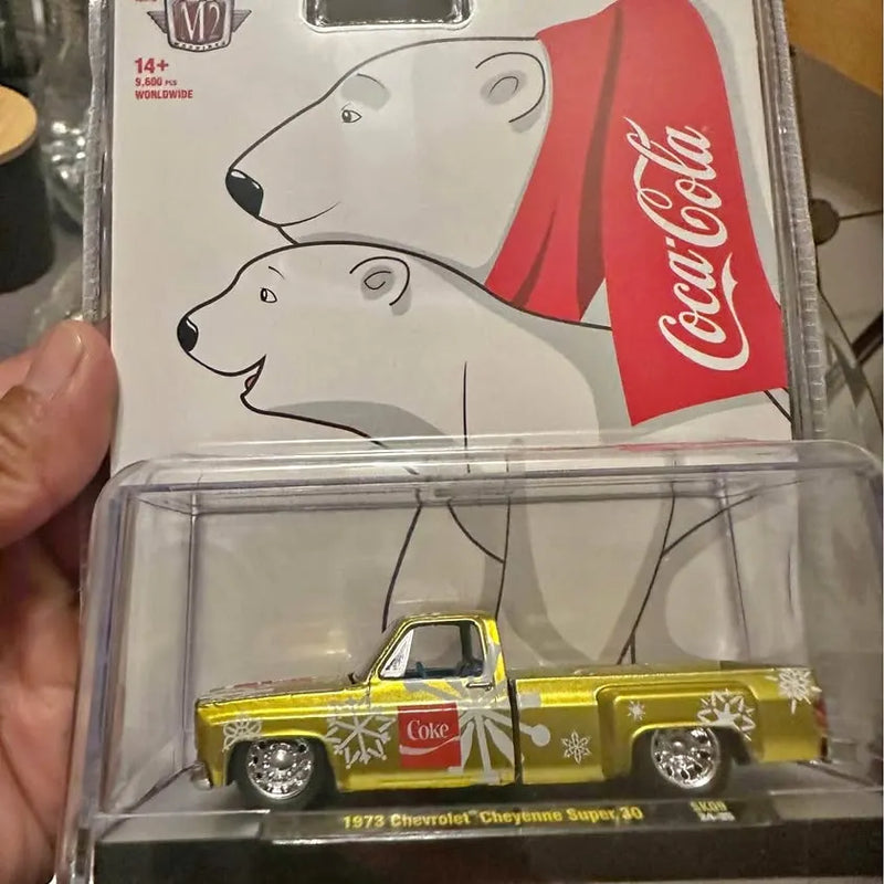 Yellow 1973 Chevrolet Cheyenne Super 20 diecast pickup truck with Coke graphics