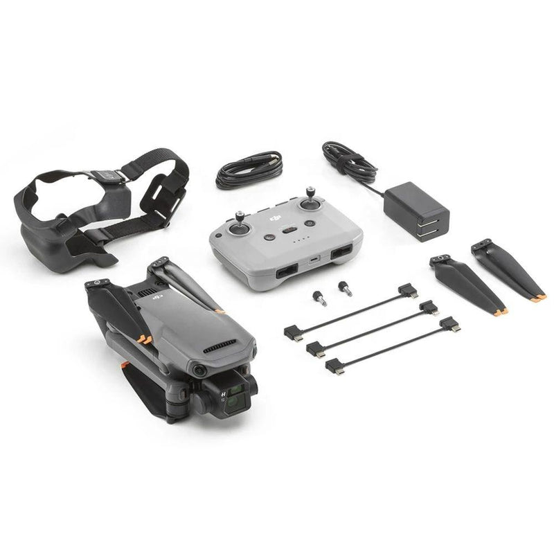 Professional drone with controller, cables, battery, and mounting accessories, shown unpacked