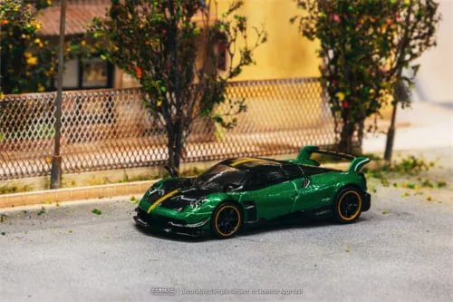 Green 1:64 diecast model sports car with black accents and gold wheels