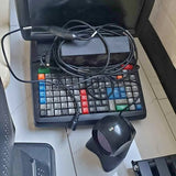Black computer keyboard with numeric keypad and connected cables, with black mouse