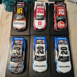 Set of six NASCAR diecast race cars, blue/black and white with numbers 20–21.