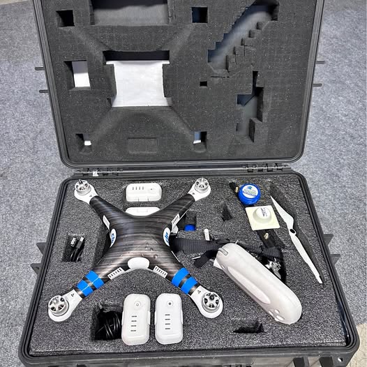 Drone hard case with foam insert, spare parts, propellers, and controller modules