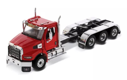 Red diecast Western Star truck cab with black chassis, front grille and wheels visible