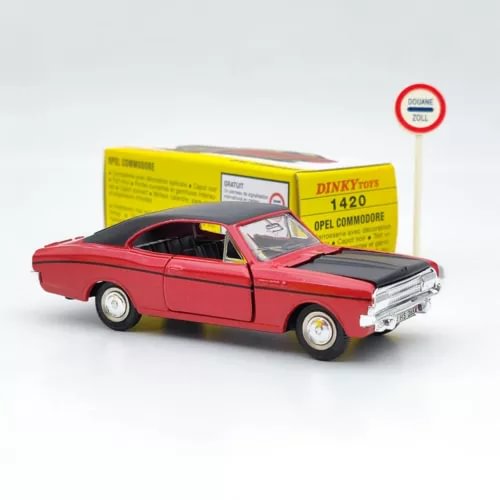 Red diecast model car, black roof, chrome front, with yellow Dinky box