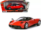 Red Pagani Huayra diecast model car with chrome wheels, front 3/4 view