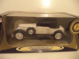 Classic white diecast car model in display box, detailed wheels and grille