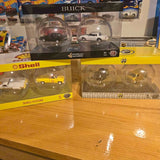 Diecast model car in clear blister packaging, yellow car with white car details