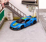 Blue racing sports diecast car model with yellow stripes and black wheels