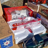 Texaco diecast car assortment in red-and-white blister packaging with two cars
