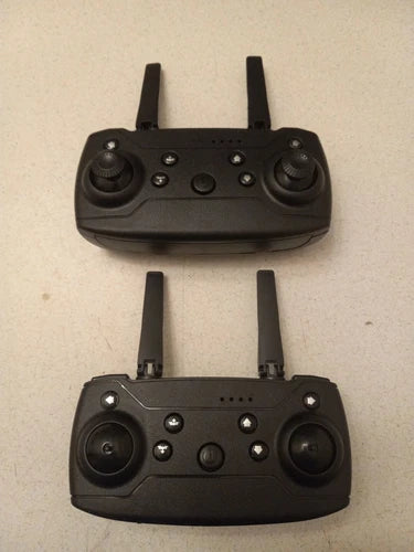 Black drone controller with dual joysticks, antennas, and buttons