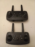 Black drone controller with dual joysticks, antennas, and buttons
