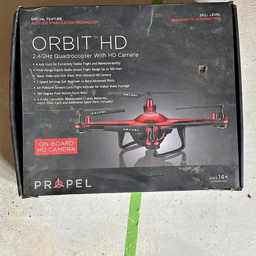 Drone quadcopter with HD camera product box, red drone illustration and text
