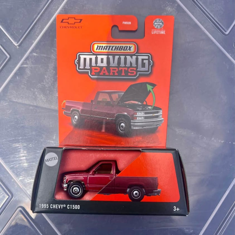 Diecast Chevrolet C1500 truck model in red retail display box