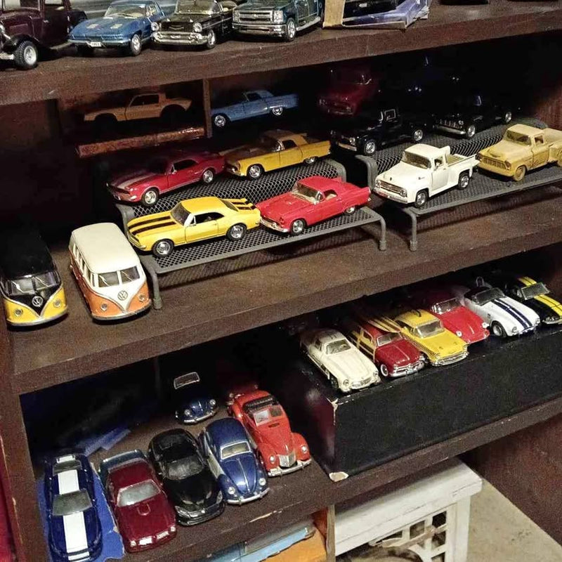 Diecast car and truck assortment on display shelf