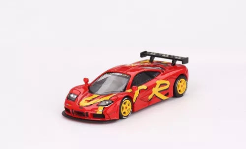 Mini GT 1:64 McLaren F1 GTR 1996 diecast, red with yellow racing decals, front 3/4