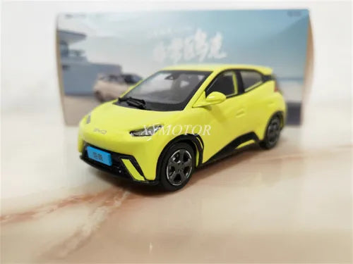 Yellow BYD Seagull EV diecast metal model car, front 3/4 view