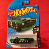 Green Triumph TR6 1/10 diecast race car in Hot Wheels blister pack, front 3/4 view