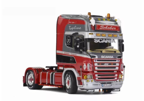 Red diecast model tractor truck cab with chrome grille and SCANIA badge