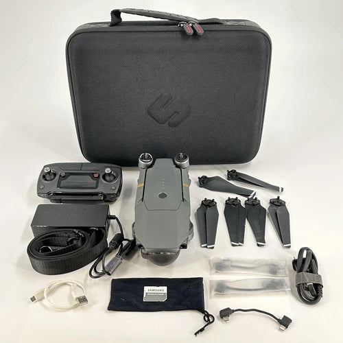 DJI Mavic Pro drone kit with DJI RC, spare propellers, cables, and carrying case