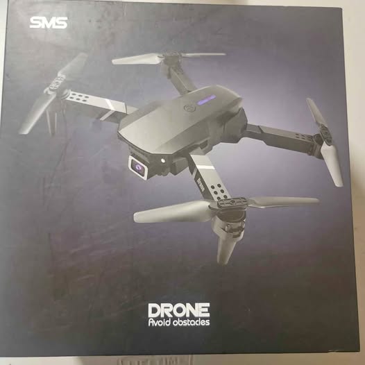 Gray quadcopter drone with camera and four propellers, obstacle avoidance design