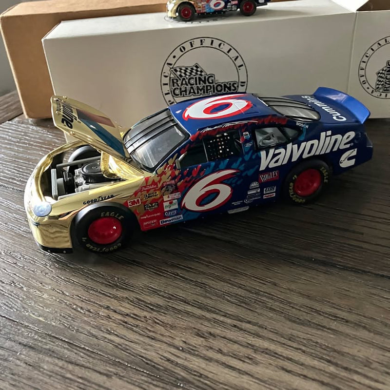 Blue Valvoline #6 racing die-cast car with red wheels and hood details