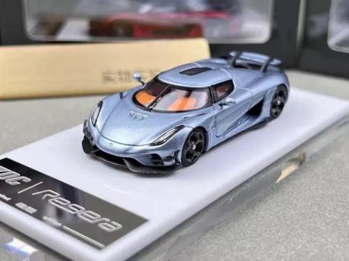 Ice blue diecast racing car model with black wheels on display base