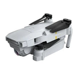 Foldable pocket selfie drone with camera, white body and folded black prop arms
