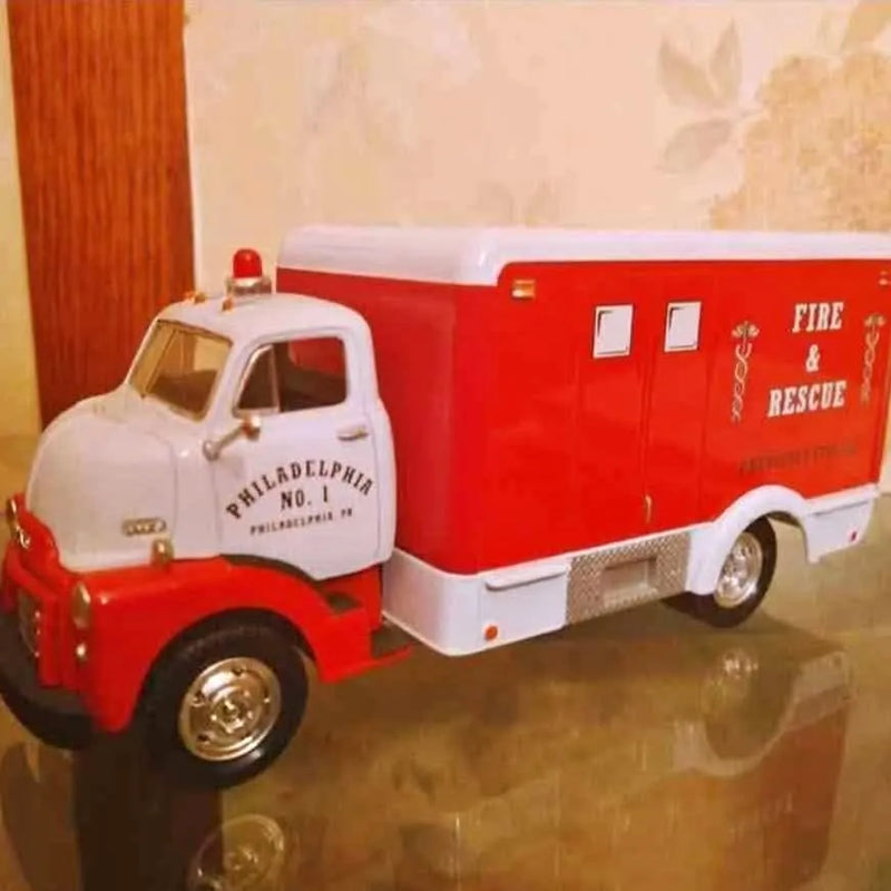 First Gear diecast rescue truck, red and white with fire & rescue lettering and side doors