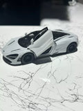 White 1:36 diecast sports car toy with raised door, detailed wheels and front lights