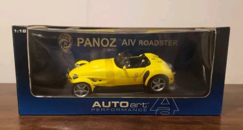 Yellow Panoz AIV Roadster diecast car in 1:18 retail box