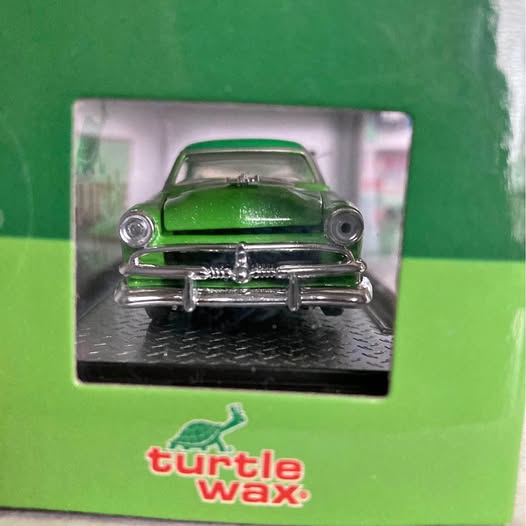 Green 1953 Ford Crestline Victoria diecast model car with chrome front bumper