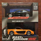 Orange die-cast sports car model with black hood and silver wheels in retail box