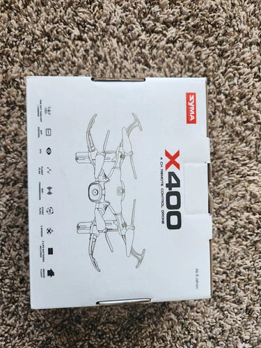 SYMA X400 drone box with assembly diagram, open package