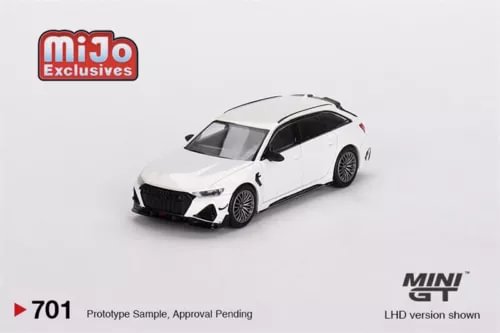 Diecast model car in white metallic, front three-quarter view, detailed grille and headlights.