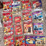Diecast car collectible packages, Speed Racer-themed Johnny Lightning and Hot Wheels