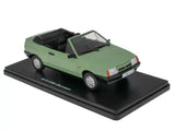 Light green diecast miniature convertible car with black roof on display base