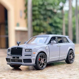 Diecast toy SUV car model with sound and light, white, front grille view