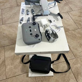 DJI Mini 2 Fly More combo drone kit with controller, batteries, and storage case
