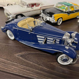 1/18 scale diecast roadster model car, blue with chrome trim and wire wheels