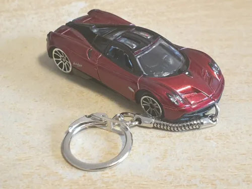 Burgundy red diecast toy car keychain with metal keyring and chrome details