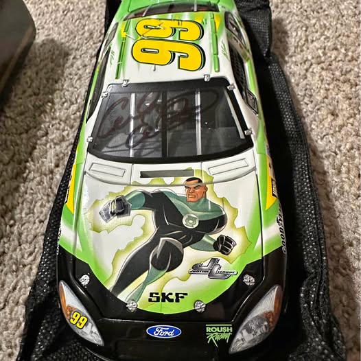 Green race car diecast model with number 99, Ford and Roush decals