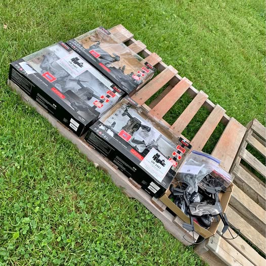 Drone kit boxes and parts on wooden pallet