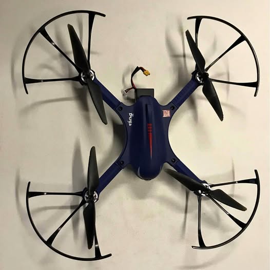 Blue quadcopter drone with four propellers