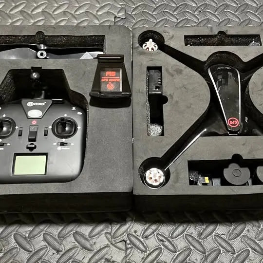 Drone remote controller with LCD screen, buttons, and two control sticks